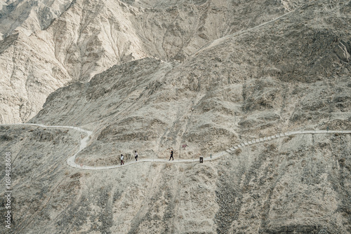 Overhanging Great Wall in Jiayuguan, China. The west end of the Great Wall of China in Autumn. The Great Wall appears very like a dragon overhanging the slope.