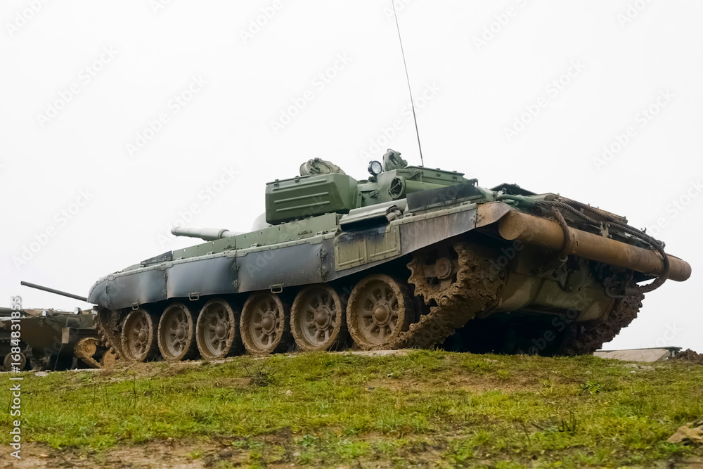 Fototapeta premium T-72 tank testing at proving ground overall view with hull and turret details.