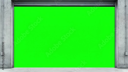Industrial Metal Garage Door Opening Upwards to Reveal a Chroma Key Green Screen Background