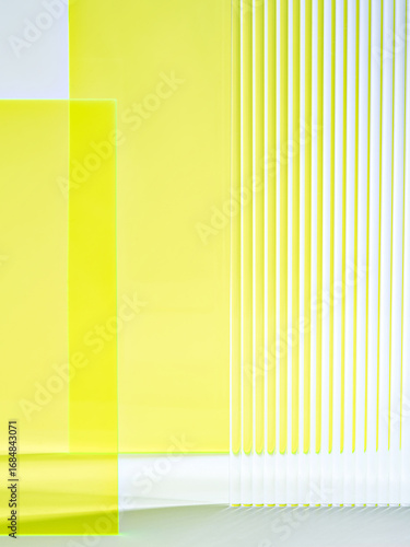 Real photo. A modern abstract composition featuring translucent yellow acrylic sheets with soft gradients. Perfect as a display background for showcasing jewelry, cosmetics, or luxury accessories.