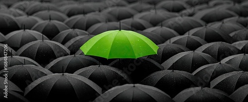 Green Umbrella in Black Crowd