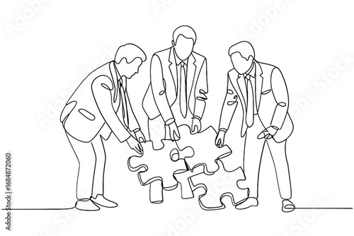 Business team collaborating to solve a puzzle together