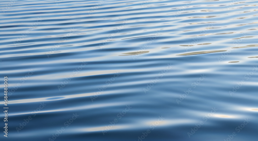 Naklejka premium Rippled Blue Water Surface with Sunlight Reflections
