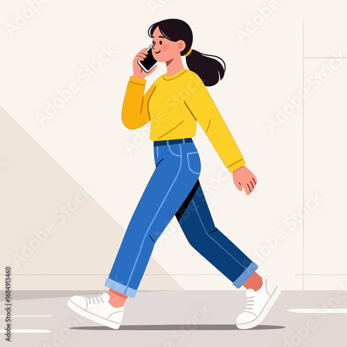 Woman Walking and Talking on Phone in Casual Outfit