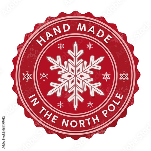 Festive red circular badge with white text saying hand made in the north pole and a large snowflake design isolated on transparent background