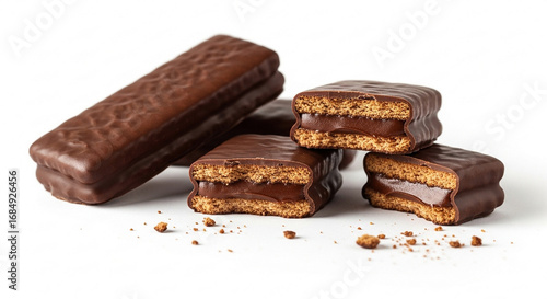 Close-up shot of chocolate-covered sandwich cookies with a creamy filling, arranged on a white surface.