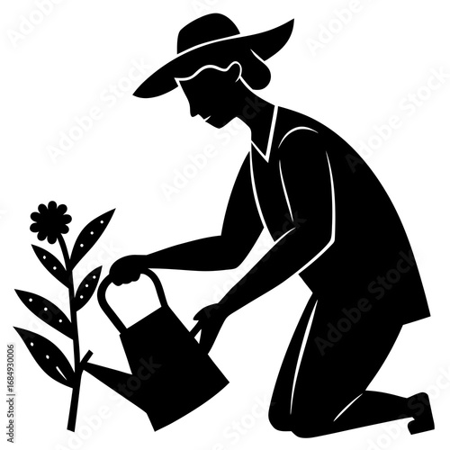 Gardener watering plant with watering can flower