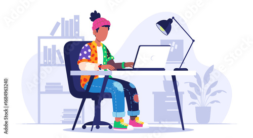 Creative individual focused on work or study at a home desk with a laptop, reflecting remote productivity and modern freelance lifestyle.