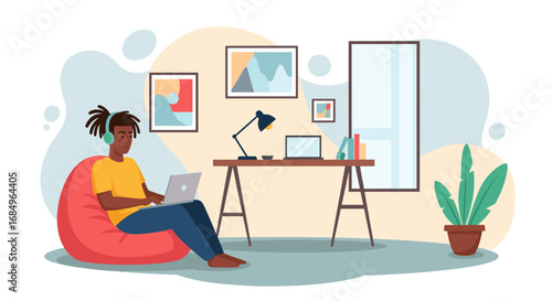 Young person works remotely on laptop from a comfortable home office, enjoying a flexible lifestyle. Ideal for remote work, online learning, or modern living concepts.