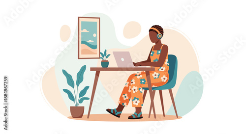 African American woman working remotely on laptop at home, wearing headphones in a comfortable, modern setting. Ideal for business, education, or lifestyle content.
