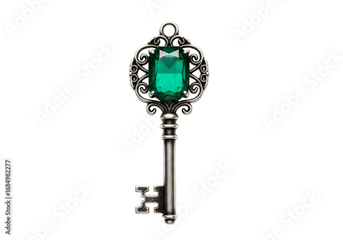 A detailed antique key, ornate with filigree, showcases a vibrant emerald gem, set against a striking black background.