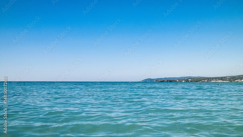Obraz premium Blue water of Tyrrhenian sea in Vada, Tuscany, Italy.
