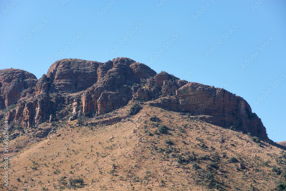 Fototapeta premium Marakele National Park safari game drive in Limpopo province, South Africa, with amazing scenic views of mountains, savanna, and wildlife habitat. The landscape combines rugged peaks, open grasslands,