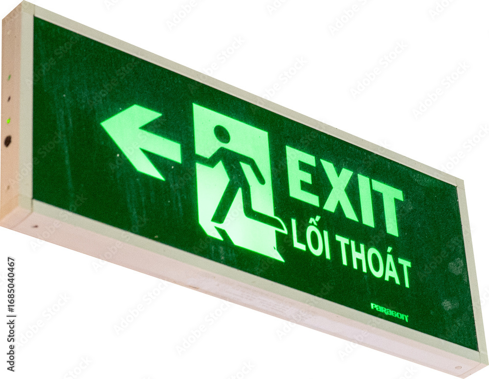 Naklejka premium Illuminated green exit sign with an arrow pointing left.