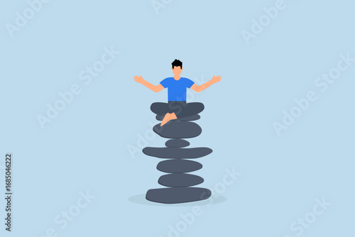 Mindfulness meditation to balance work and life, Serene and peaceful man practices meditation while seated on top of a pile of Zen rock pyramid