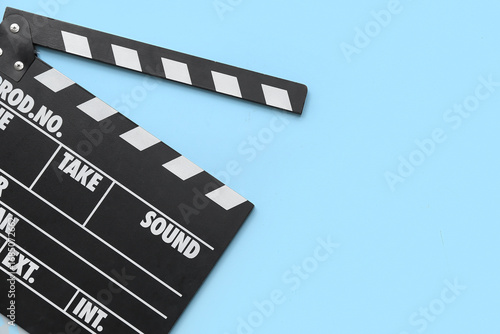 Movie clapper on blue backg...