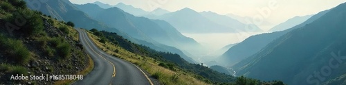 A winding road disappearing into a misty mountain range symbolizes the long and sometimes unclear path of patience, requiring perseverance to reach the destination , distance, patience, challenge