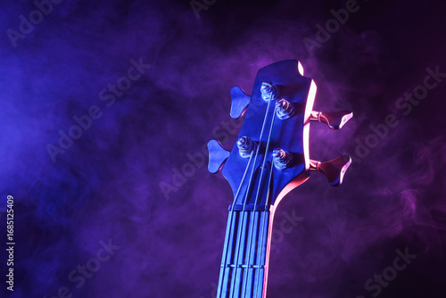 Fotografie Modern electric guitar on dark background, closeup