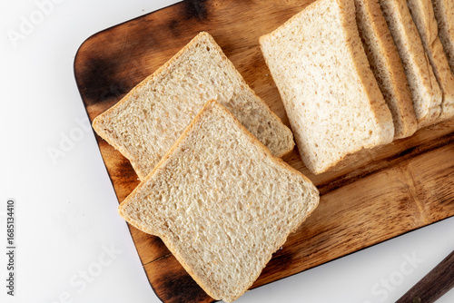 Wallpaper Mural Slices of Fresh Whole Wheat Bread on Wooden Cutting Board Torontodigital.ca