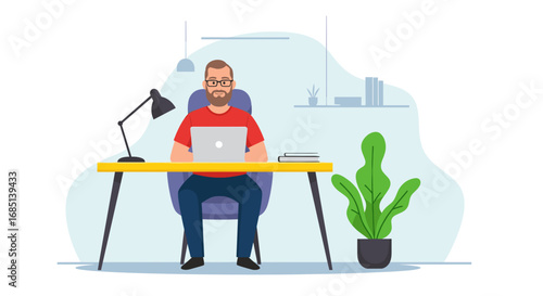 Professional man focused on his laptop at a tidy home office desk. Perfect for illustrating remote work, online business, and modern lifestyle concepts.