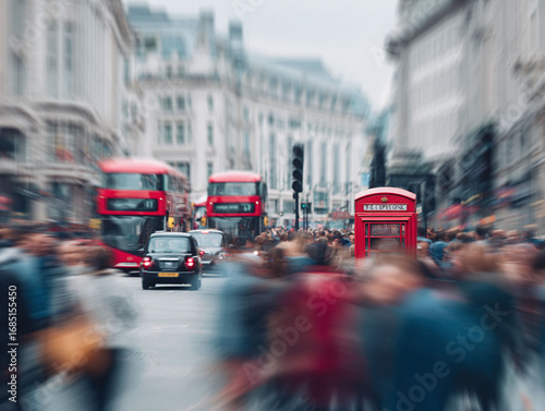 Dynamic London street scene featuring a red telephone booth, blurred motion of buses and people, evoking a sense of travel, culture, and bustling city life.