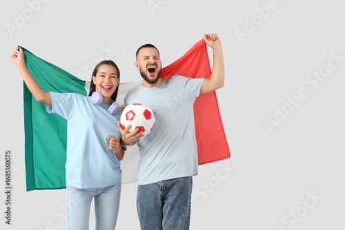 Couple of sports fans with ...