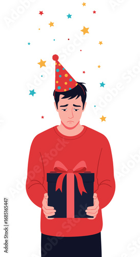 Unhappy young man wearing party hat holding birthday gift box with ribbons sad emotion