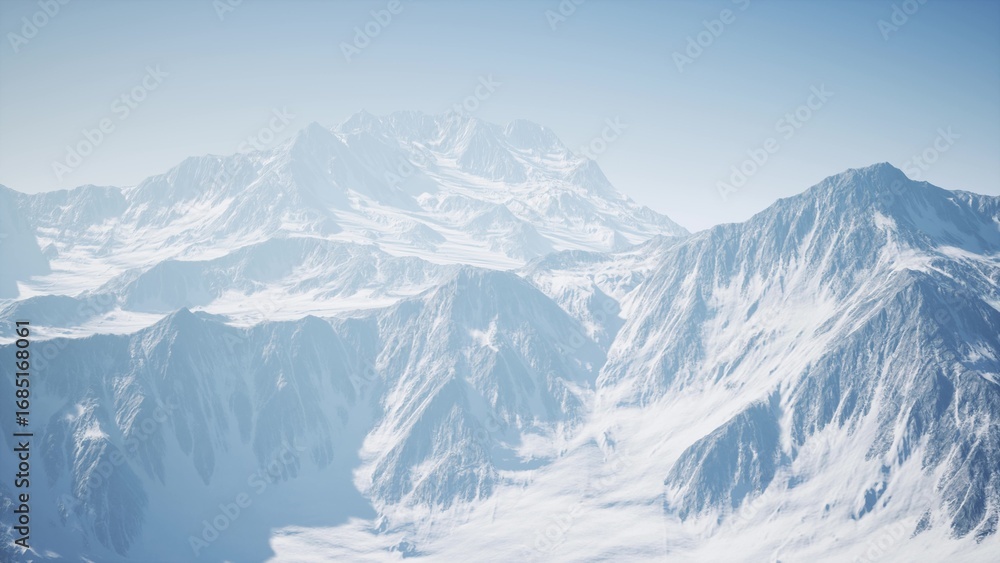 Obraz premium Snow capped peaks rise majestically into the clear blue sky, casting soft shadows over the tranquil valleys below, creating a breathtaking winter landscape during early morning light.