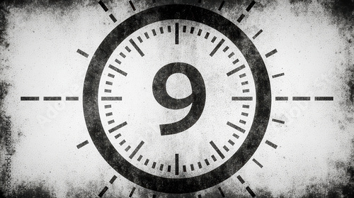 A retro movie countdown timer with a clock hand at nine.