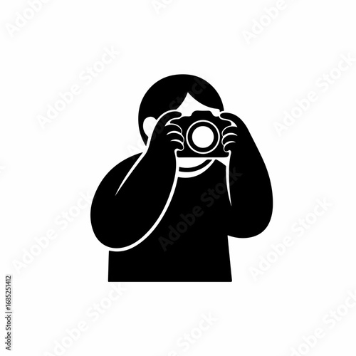 Black silhouette icon of a photographer holding a camera.