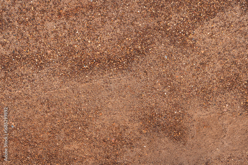 Dirt, terrain or gravel stone road surface pattern in outdoor environmental. Background and textured photo.	