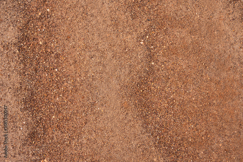 Dirt, terrain or gravel stone road surface pattern in outdoor environmental. Background and textured photo.	