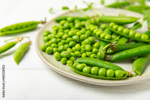 Wallpaper Mural Fresh green pea pods with green peas on a wooden background. Sweet green peas. Green pea beans vegetables. Vegan. healthy vegetable. Copy space Torontodigital.ca