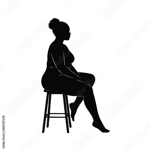 Black silhouette of a woman with curly hair in a bun sitting on a stool viewed from the side female