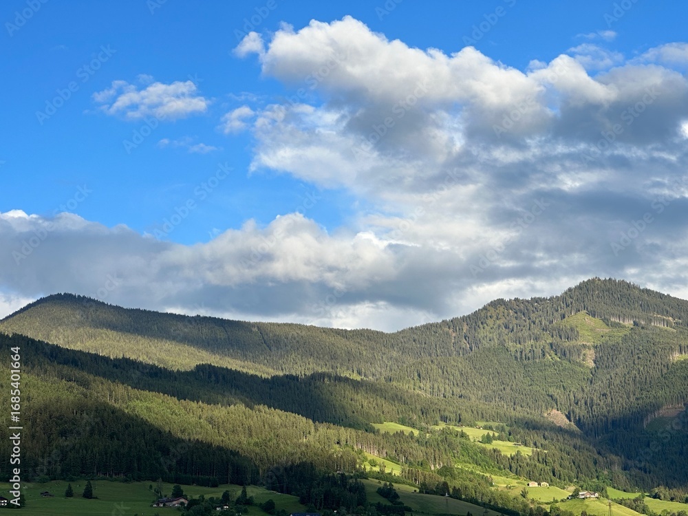 Fototapeta premium Scenic landscape with the mountains under a cloudy sky near Laideregg, Bischofshofen, Salzburg, Austria, May 2024