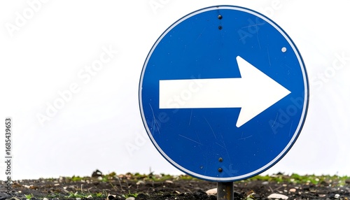 Round blue traffic sign with white arrow pointing right