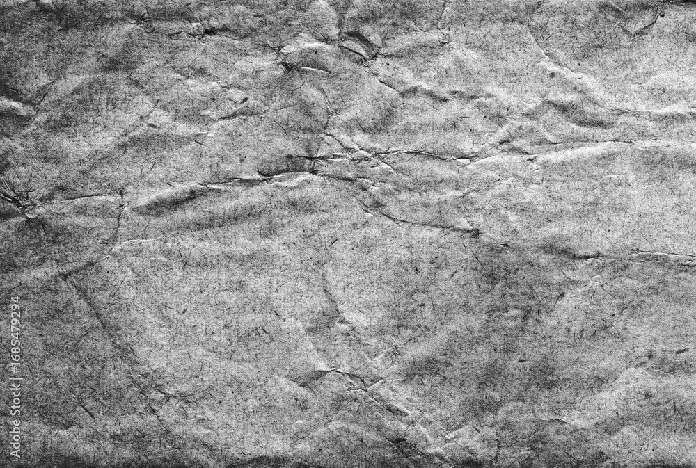 Naklejka premium Hand made old vintage distressed textured paper background which is empty and blank with copy space, monochrome black and white stationary stock photo image