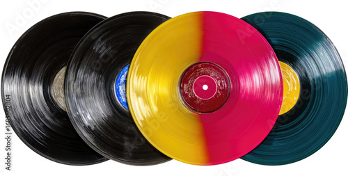 Four colorful vinyl records arranged in a horizontal row.  