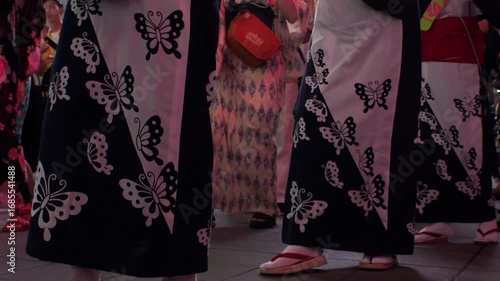 TOKYO, JAPAN - AUGUST 2025 : View of traditional Japanese dance festival “Bon Odori” in summer season. Crowd of people dancing. Japanese culture and summer season concept video.