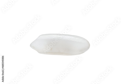 Close-up of a single grain of white rice, displaying its smooth, oblong shape against a pure black background.