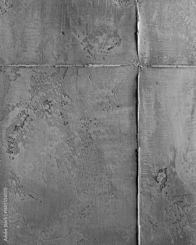 Textured gray concrete wall with visible seams and imperfections, showcasing a modern industrial aesthetic, ideal for backgrounds or design projects with a minimalist approach