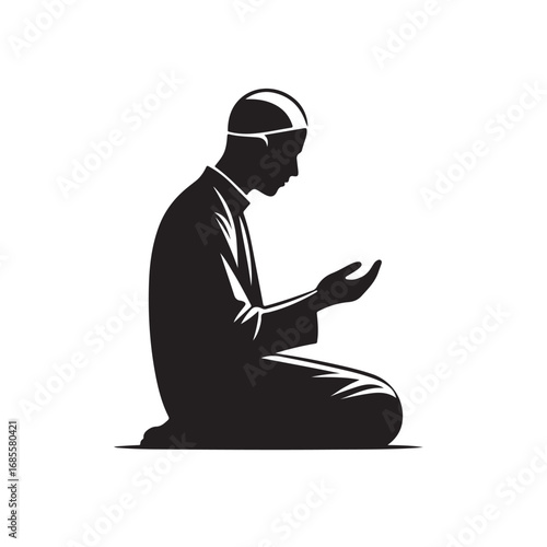 Man performing islamic prayer in a dark silhouette