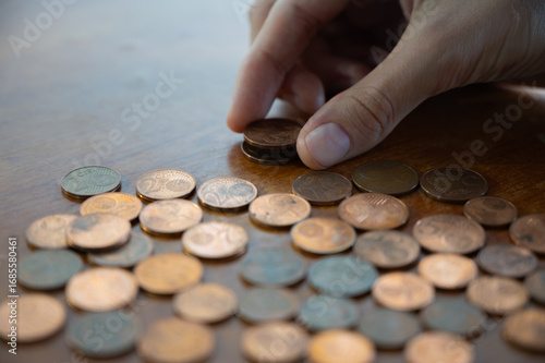 Fotografie Euro cent coins arranged flat, concept of savings, minimal money, and financial balance