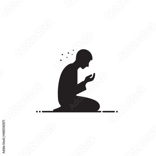 Man performing islamic prayer in a dark silhouette