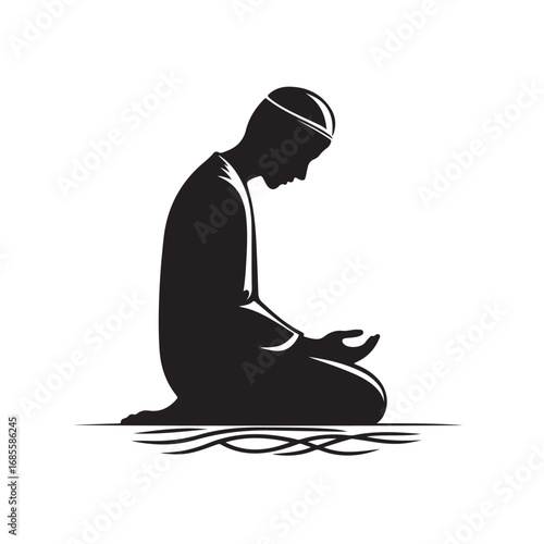 Man performing islamic prayer in a dark silhouette