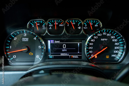 truck dashboard with warning lights, check engine and low tire warning lights
