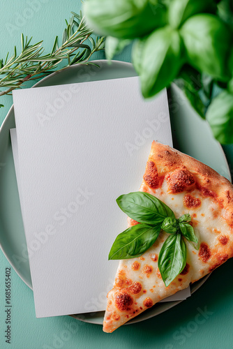 Freshly prepared pizza slice topped with basil leaves, placed elegantly on a textured plate with a blank note for personalized messages.