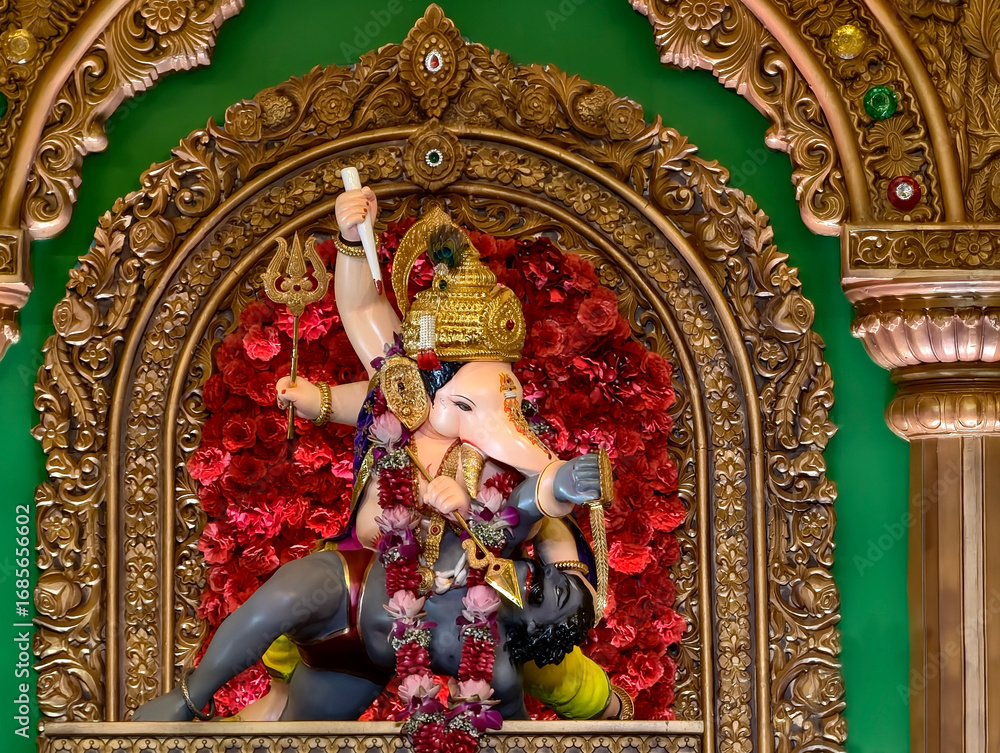 Fototapeta premium 27 August 2025, Pune, Maharashtra, India, Beautiful idol of Lord Ganesh installed by Bhausaheb Rangari Ganpati during Ganesh festival 2025.