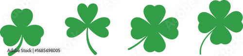 Cuadro en lienzo Four green shamrock and clover leaf shapes on a white background symbol