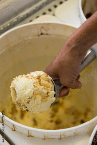 Person scooping ice cream 